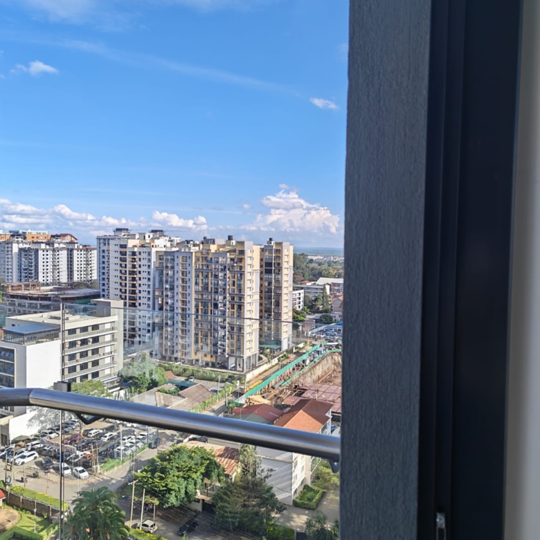 Panoramic Nairobi skyline view from a high-floor apartment at Oak Classic Residency looking toward Yaya Center.