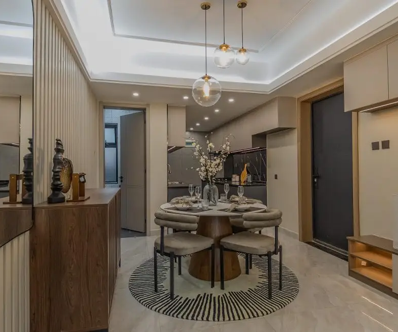 Modern apartment dining area adjoining the fitted kitchen at Oak West Residency