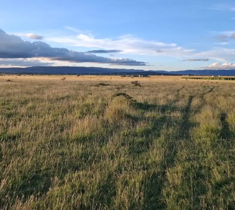Residential and commercial land for sale along Katumani Road near Konza City with scenic views and excellent development potential.