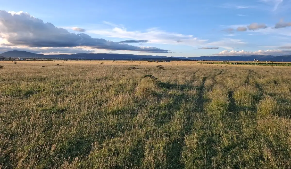 Residential and commercial land for sale along Katumani Road near Konza City with scenic views and excellent development potential.