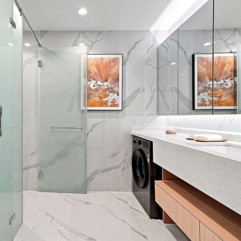 Modern bathroom and laundry area with marble-effect finishes at Stellar Bay Westlands