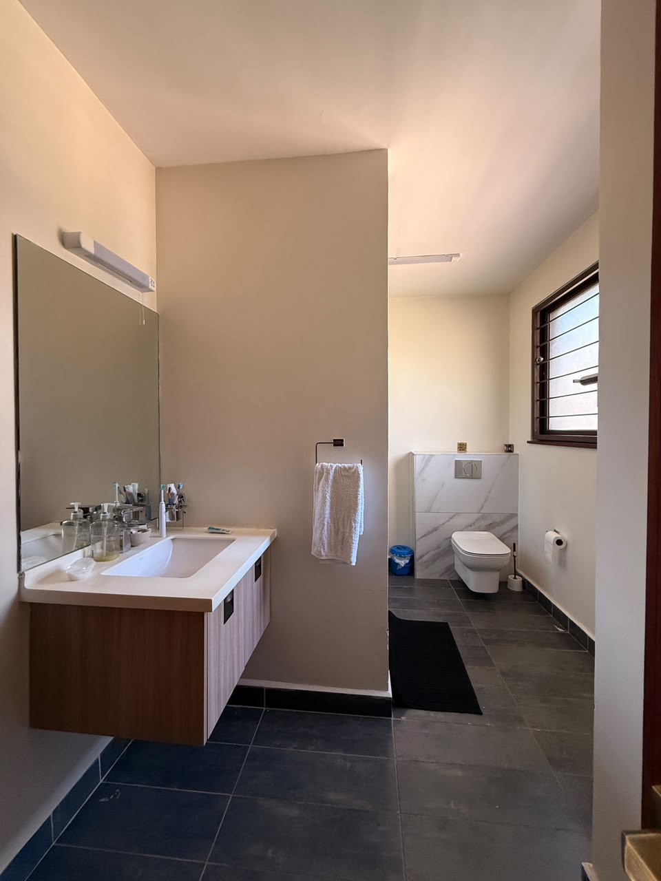 Modern bathroom vanity and wall-hung toilet at Convent Oaks Lavington