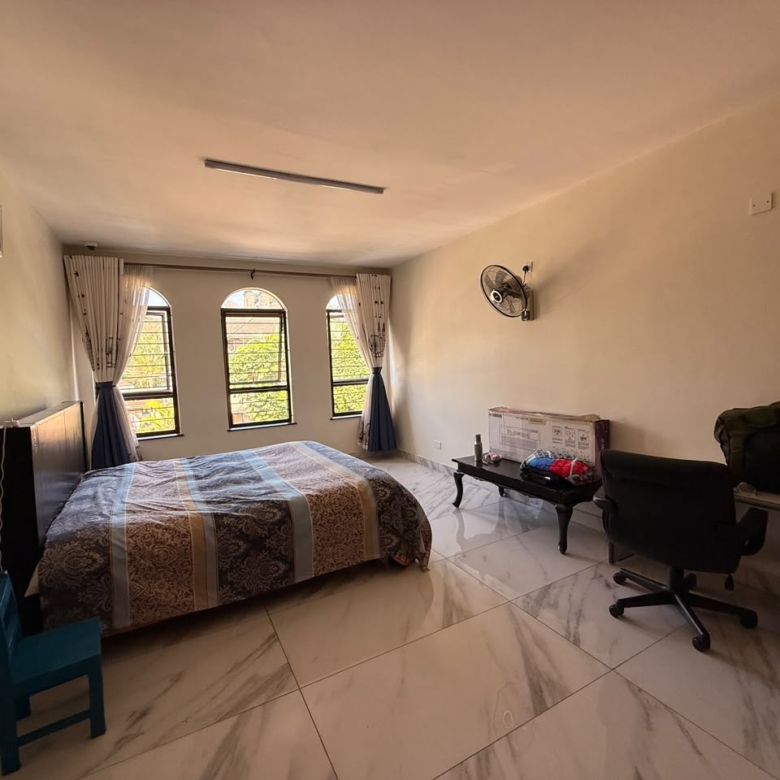 Spacious bedroom with home office area at Convent Oaks Lavington