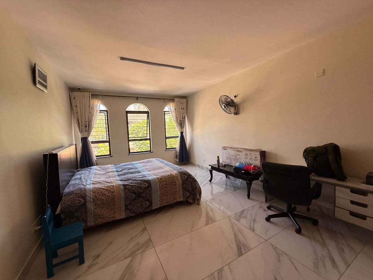 Spacious bedroom with home office area at Convent Oaks Lavington