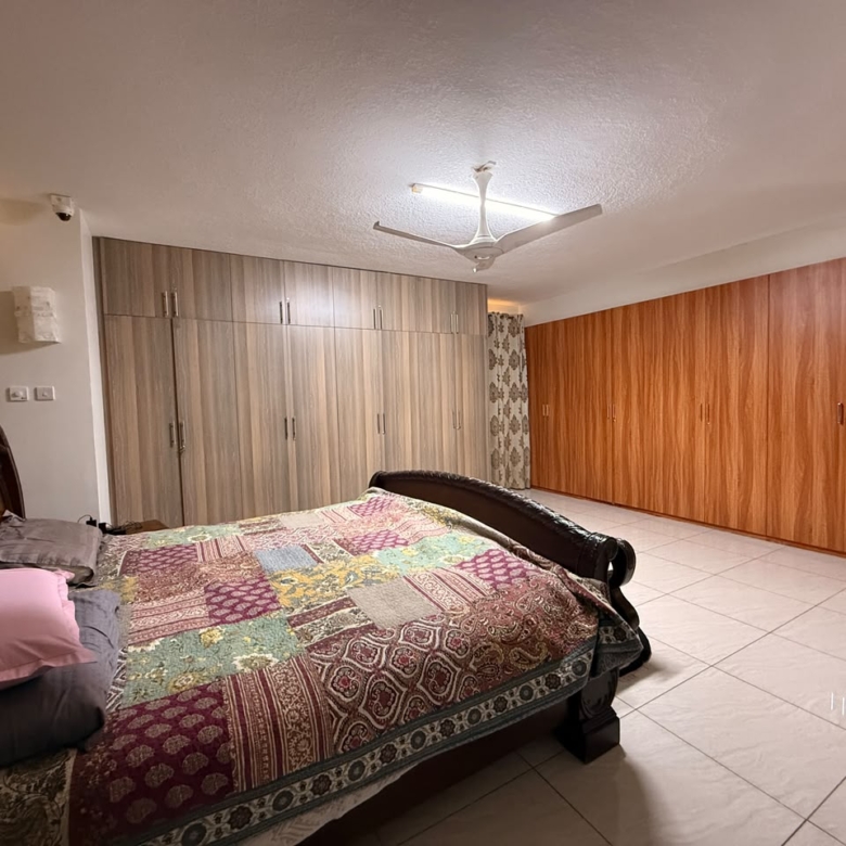 Large principal bedroom with extensive wardrobes at Convent Oaks Lavington