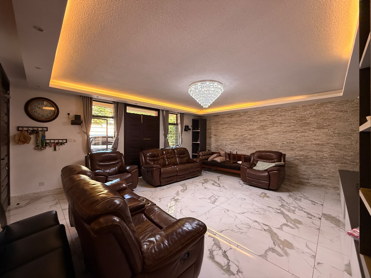 Spacious family lounge with leather seating at Convent Oaks Lavington
