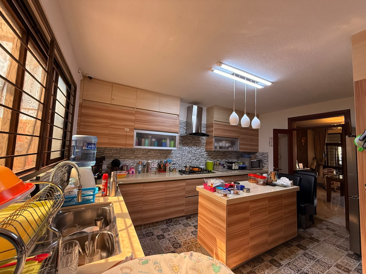 Modern fitted kitchen with central island at Convent Oaks Lavington
