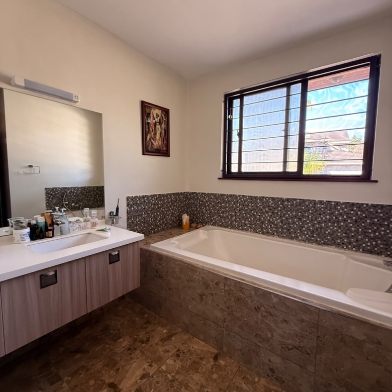 Principal bathroom with bathtub and vanity at Convent Oaks Lavington