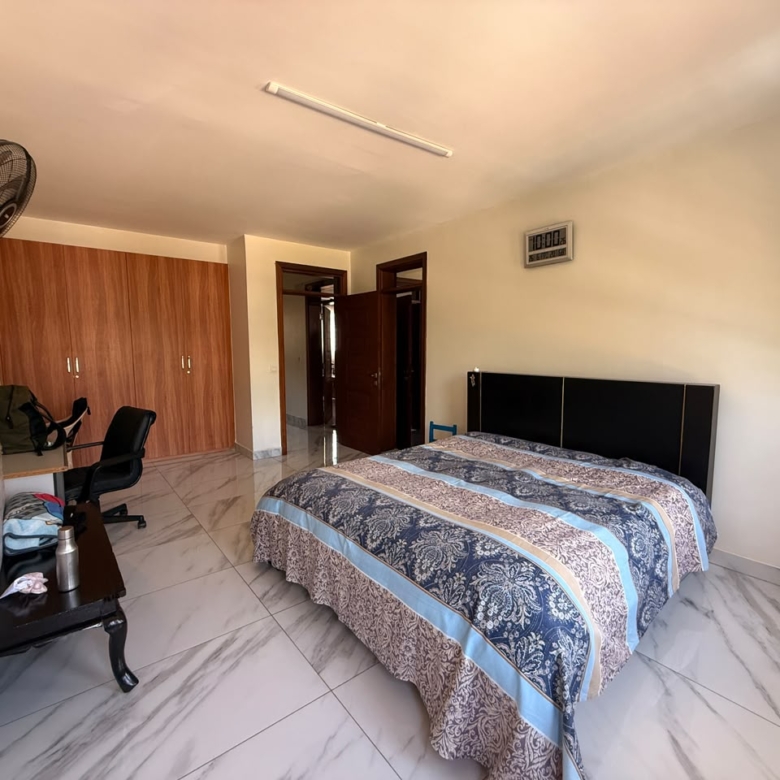 Spacious guest bedroom with built-in wardrobes at Convent Oaks Lavington