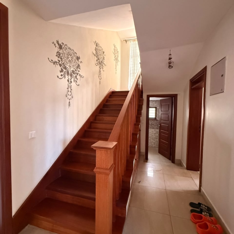 Solid wooden staircase inside the Convent Oaks Lavington townhouse