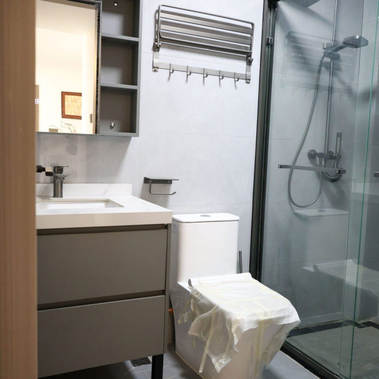 Modern bathroom with glass shower in a 1 bedroom apartment in Kilimani
