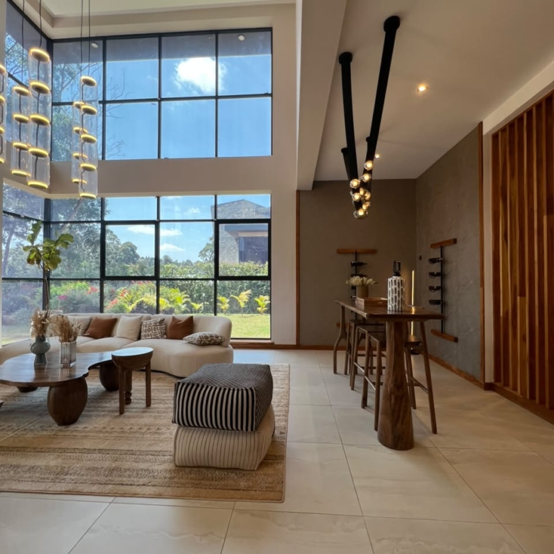 Double-height living room in an Oak and Ivy villa in Loresho
