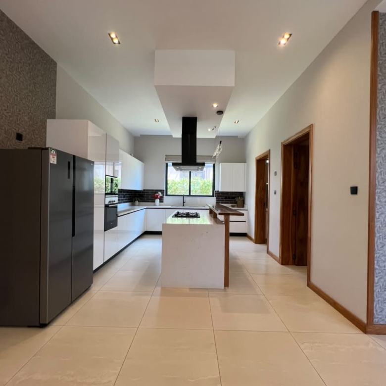 Modern fitted kitchen with island in a luxury Loresho villa