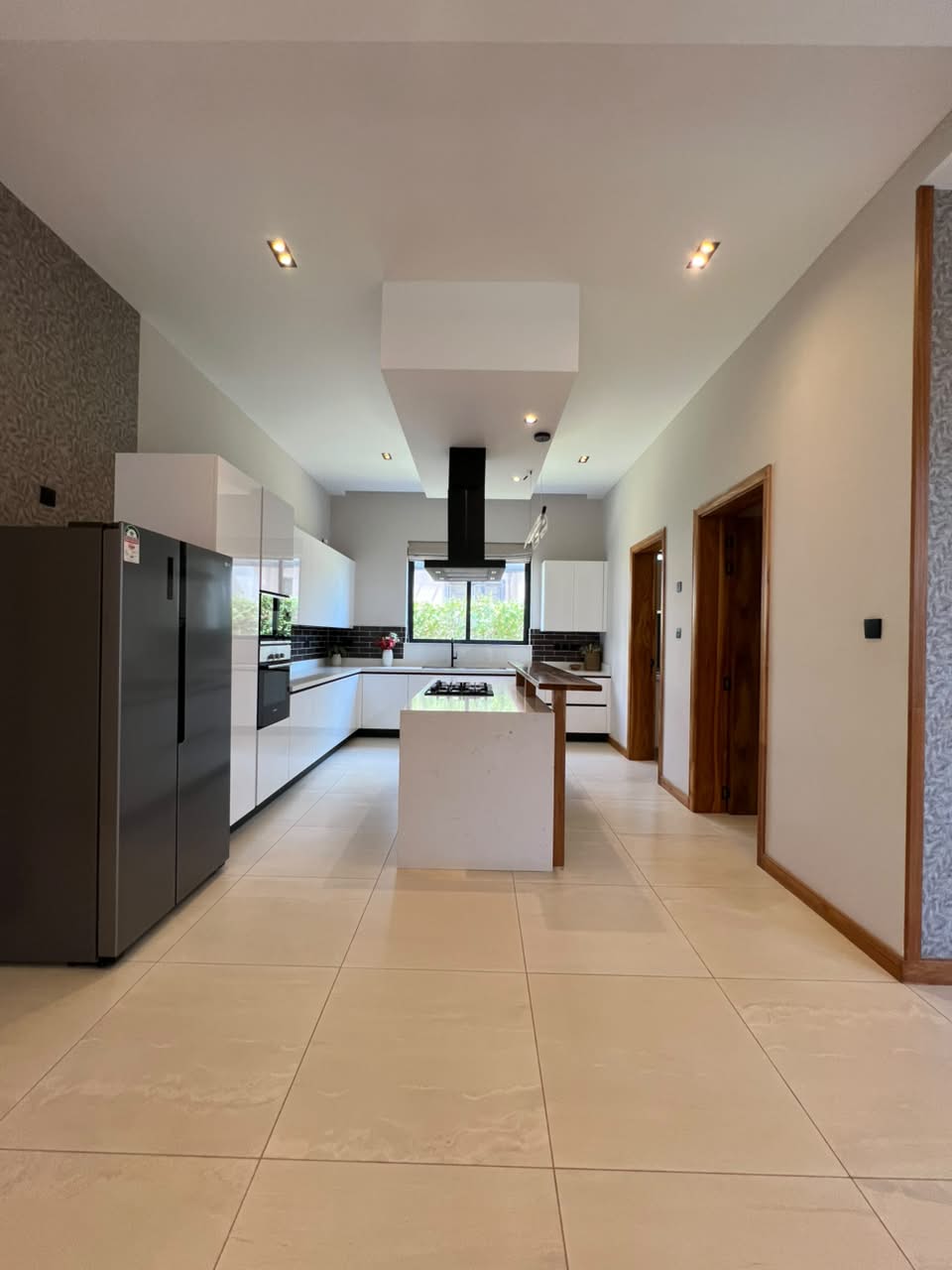 Modern fitted kitchen with island in a luxury Loresho villa