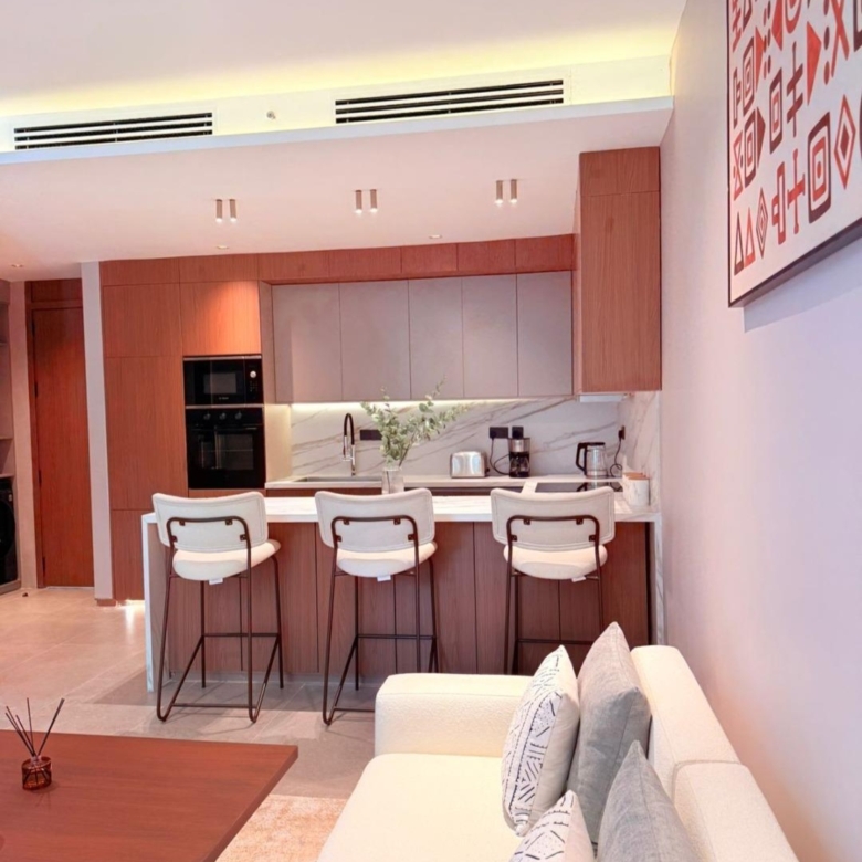 Modern fitted kitchen and furnished lounge at Silva Gigiri apartments