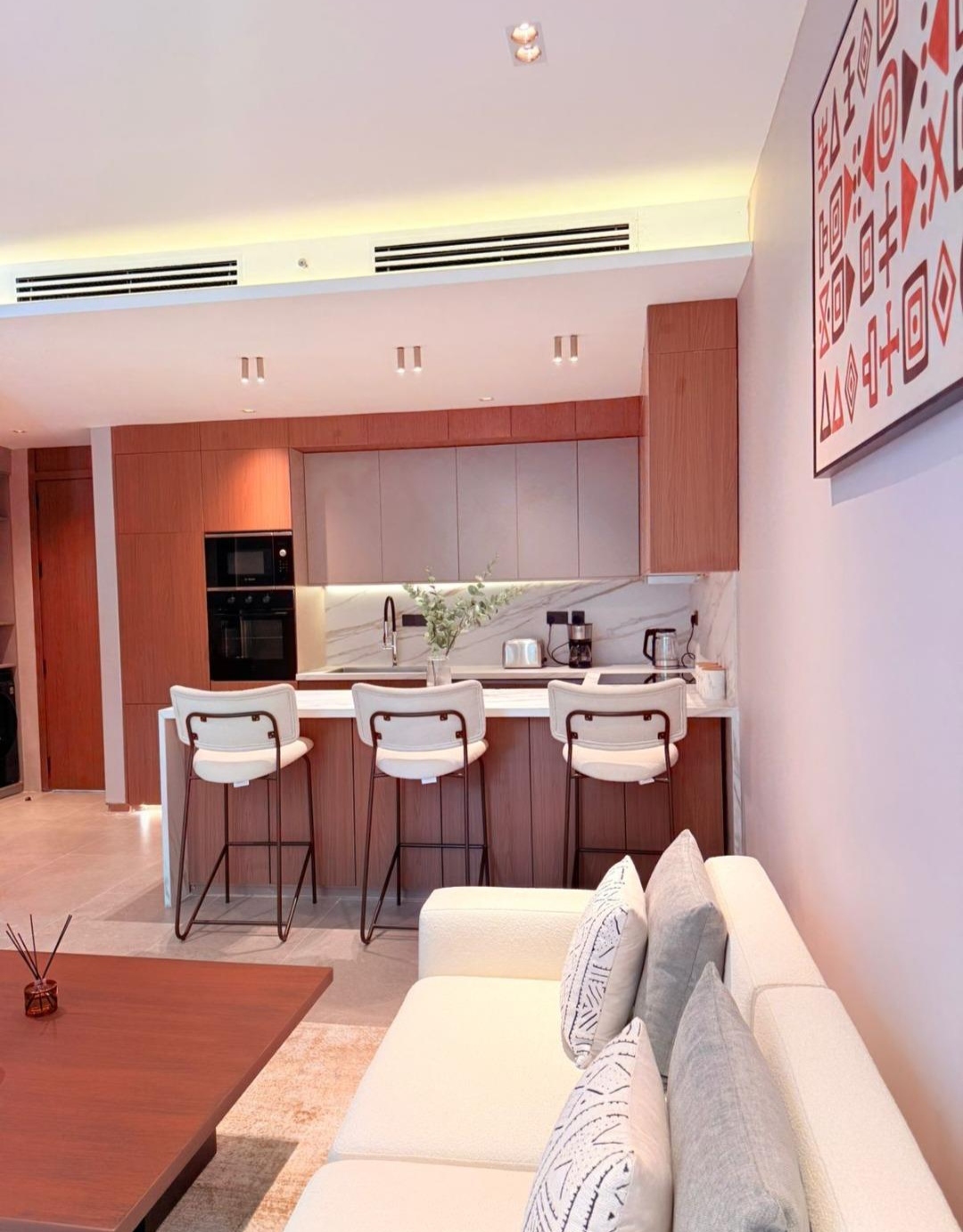 Modern fitted kitchen and furnished lounge at Silva Gigiri apartments