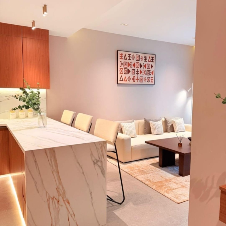 Marble kitchen island and open-plan living room at Silva Gigiri