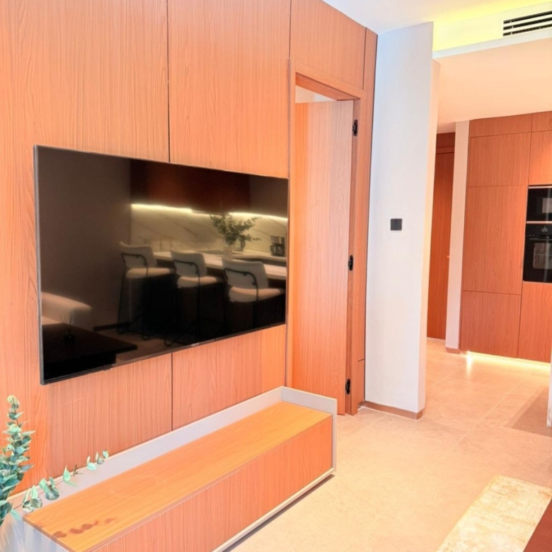 Wood-panelled television wall inside a Silva Gigiri apartment