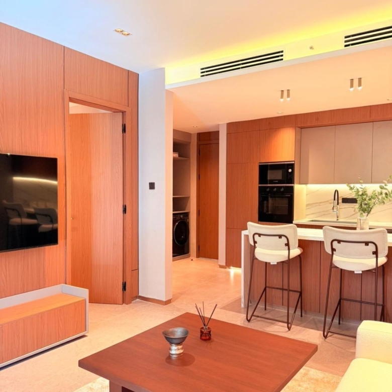 Open-plan furnished apartment with kitchen and TV area at Silva Gigiri