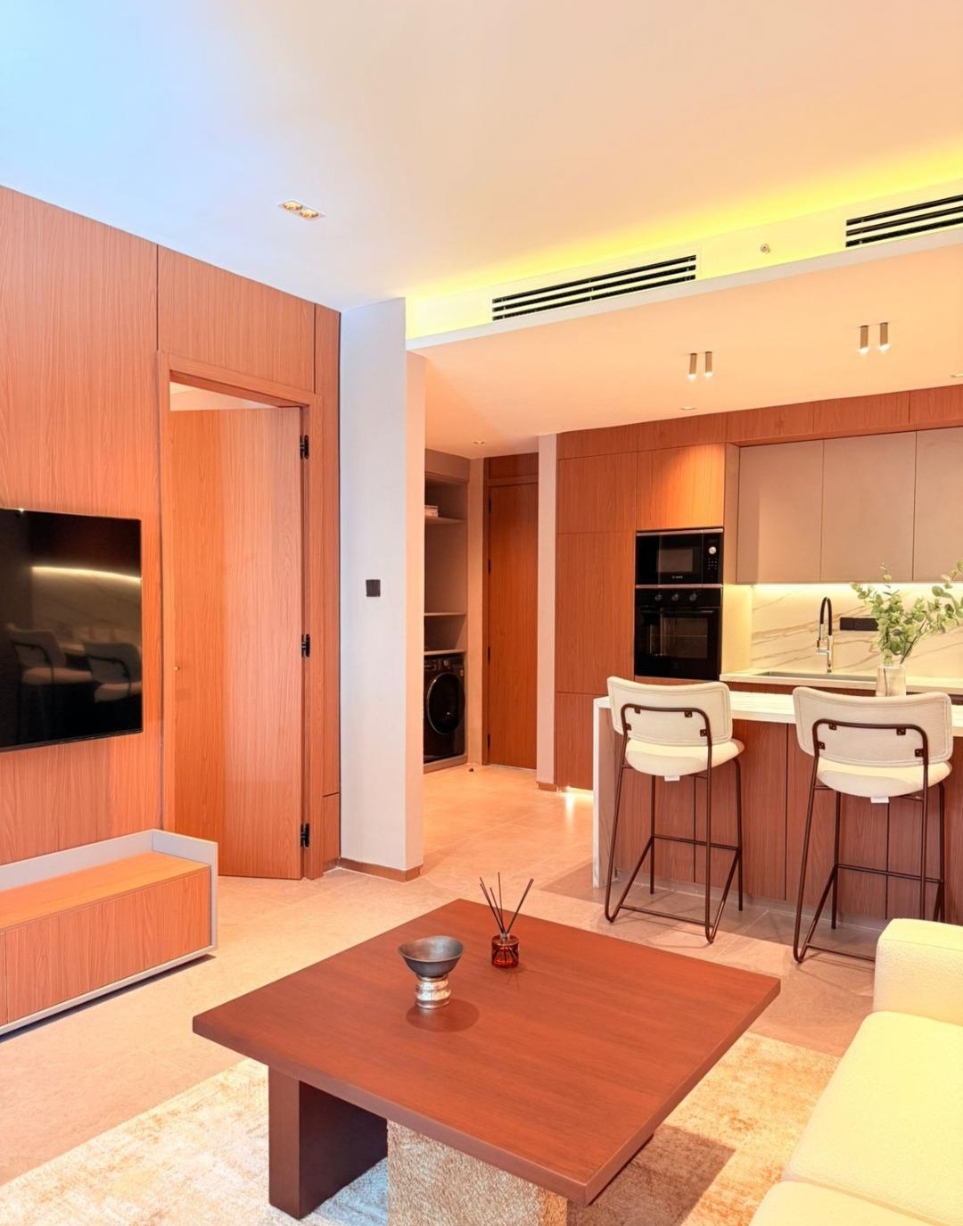 Open-plan furnished apartment with kitchen and TV area at Silva Gigiri