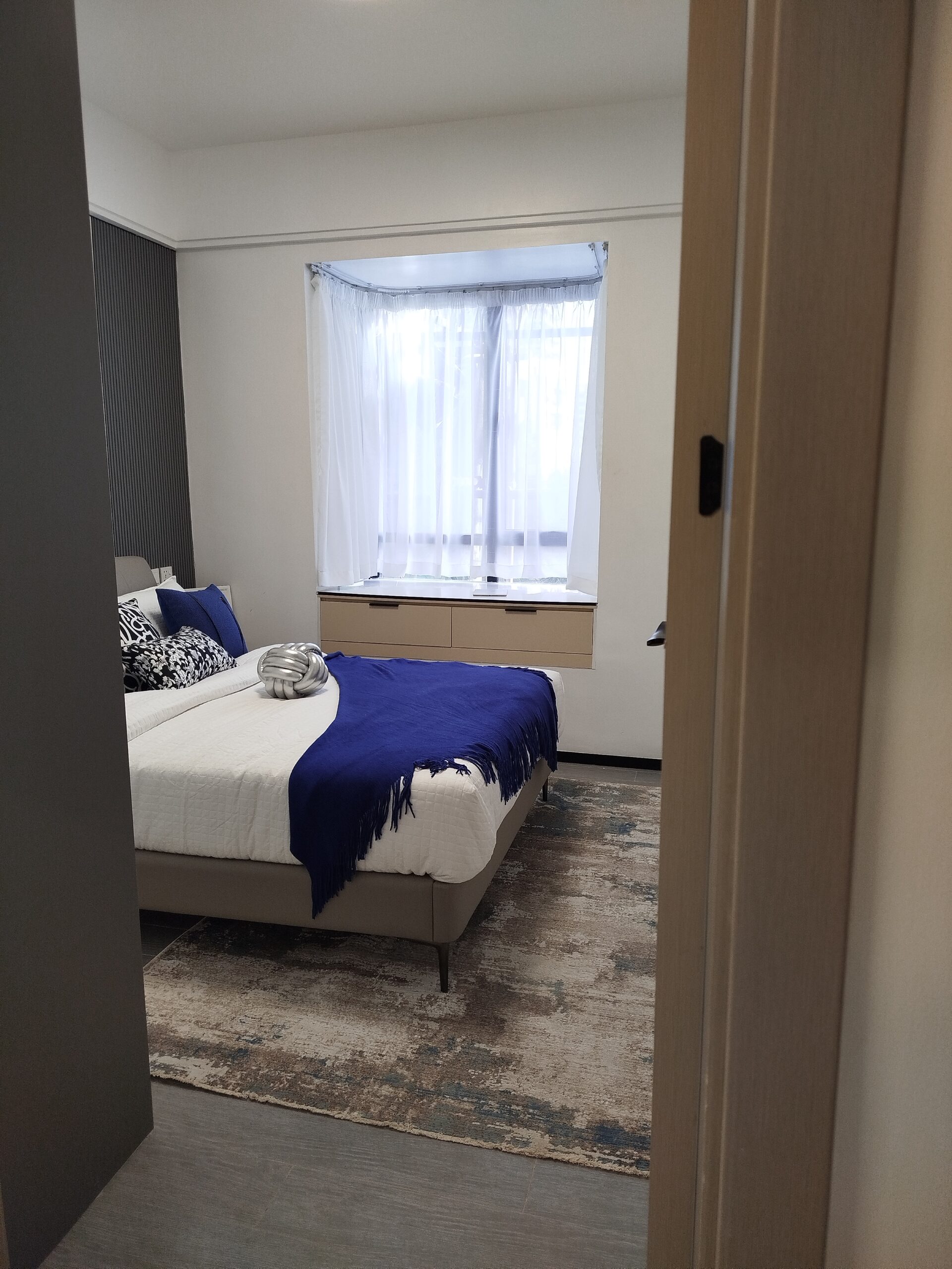 Furnished bedroom with blue accent bedding in a Westlands 2 bedroom apartment