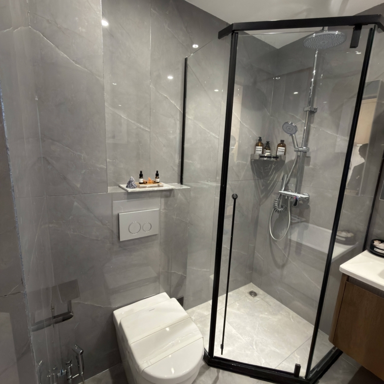 Glass shower enclosure in a modern Westlands apartment bathroom