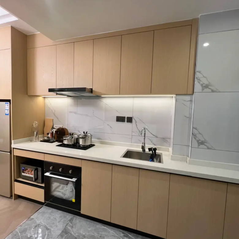 Fitted kitchen cabinets and built-in appliances in a Westlands apartment
