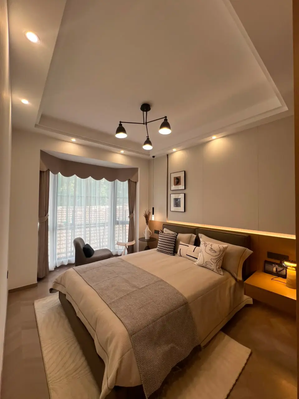 Furnished master bedroom with large window in a Westlands apartment