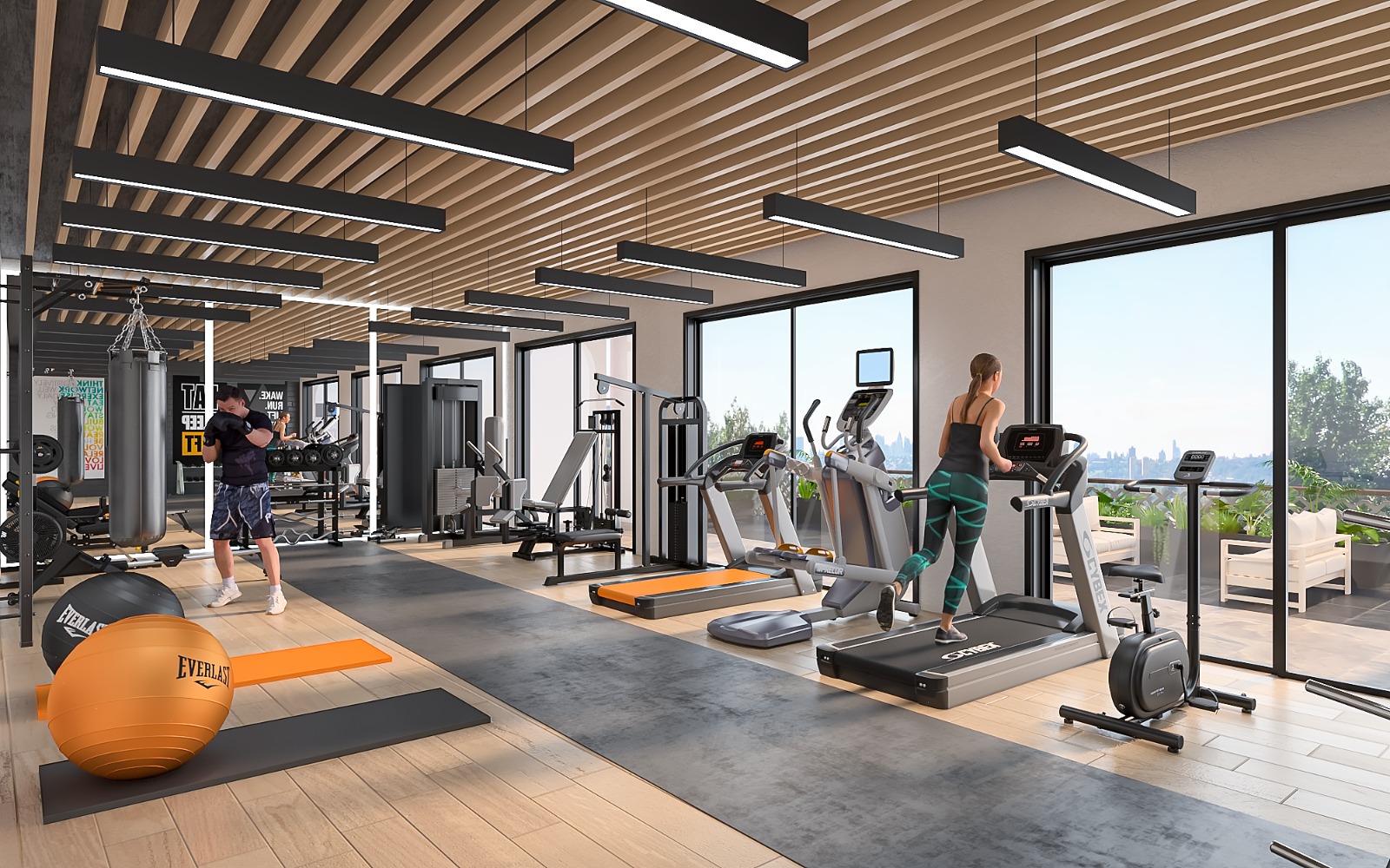 Baystar residence fully equipped gym with treadmills, exercise bikes, weight machines, dumbbells and large windows.