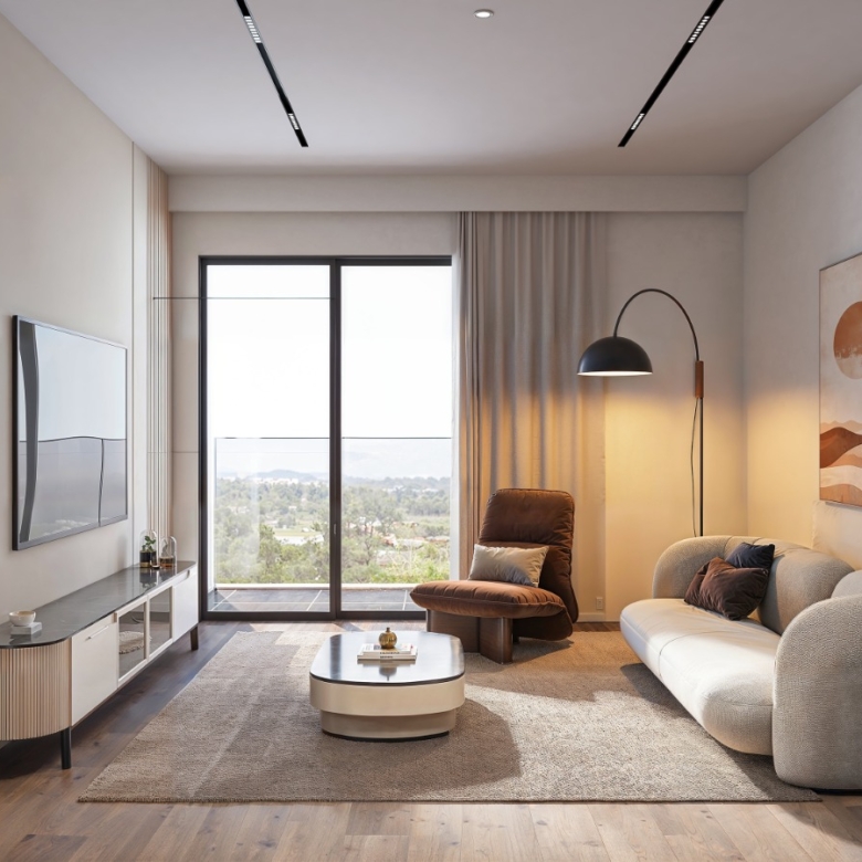 Baystar residence spacious living room with modern sofa, accent chair, balcony sliding doors and contemporary interior finishes.