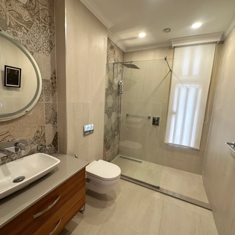 Modern bathroom with walk-in shower and floating vanity
