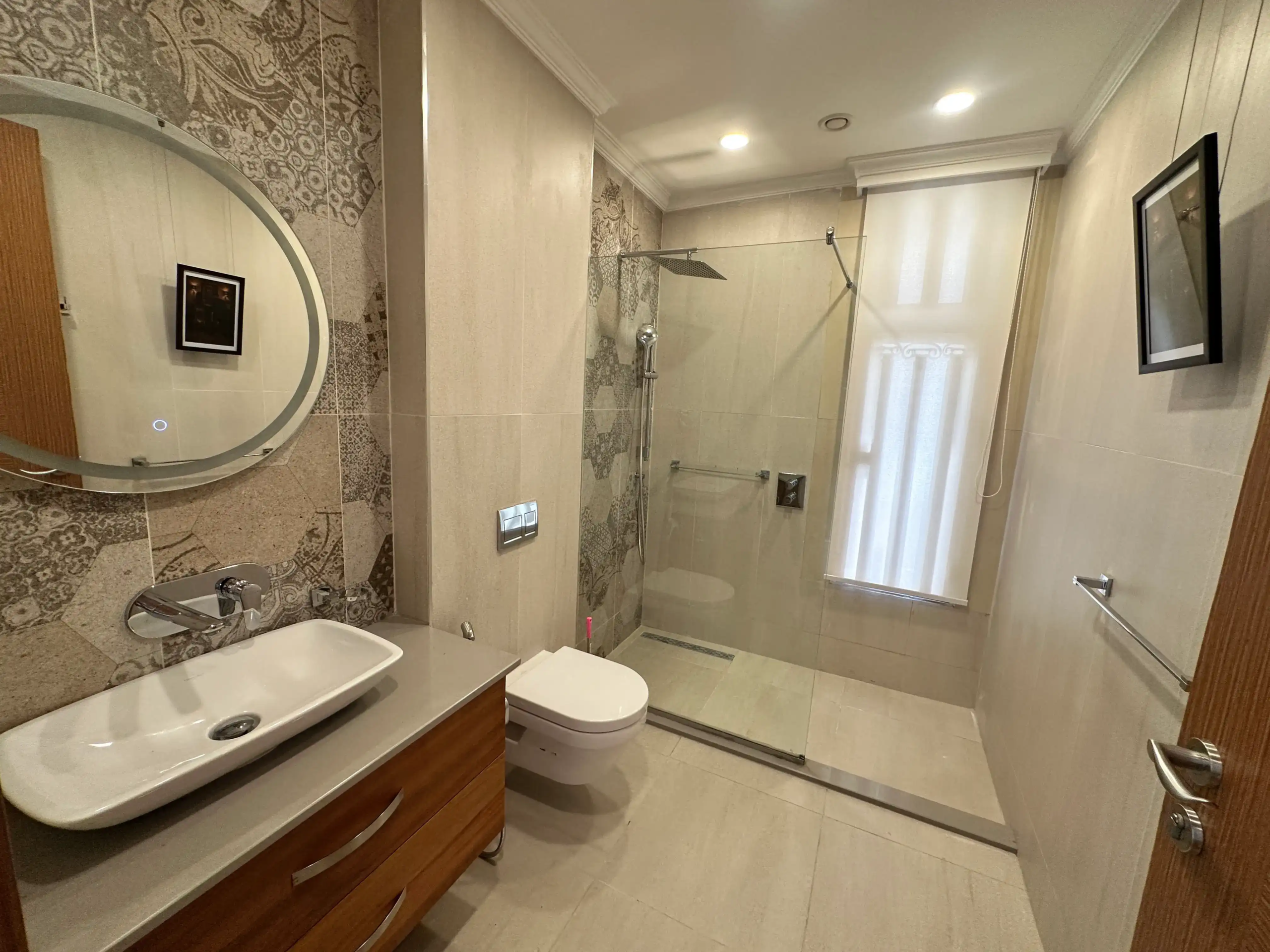 Modern bathroom with walk-in shower and floating vanity