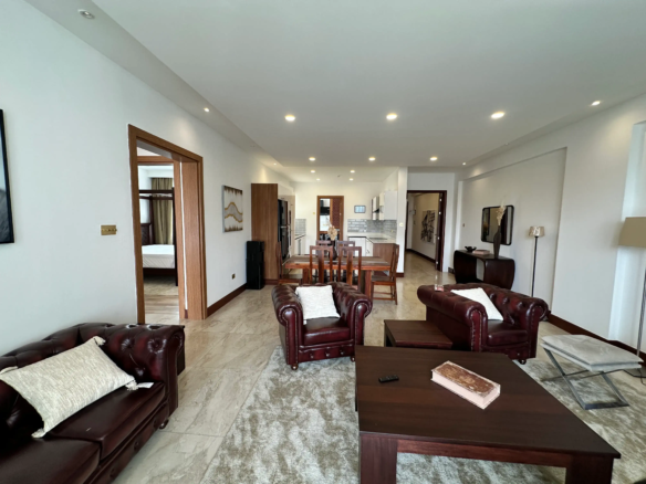 Furnished two-bedroom living and dining area at Colosseum Residences Parklands