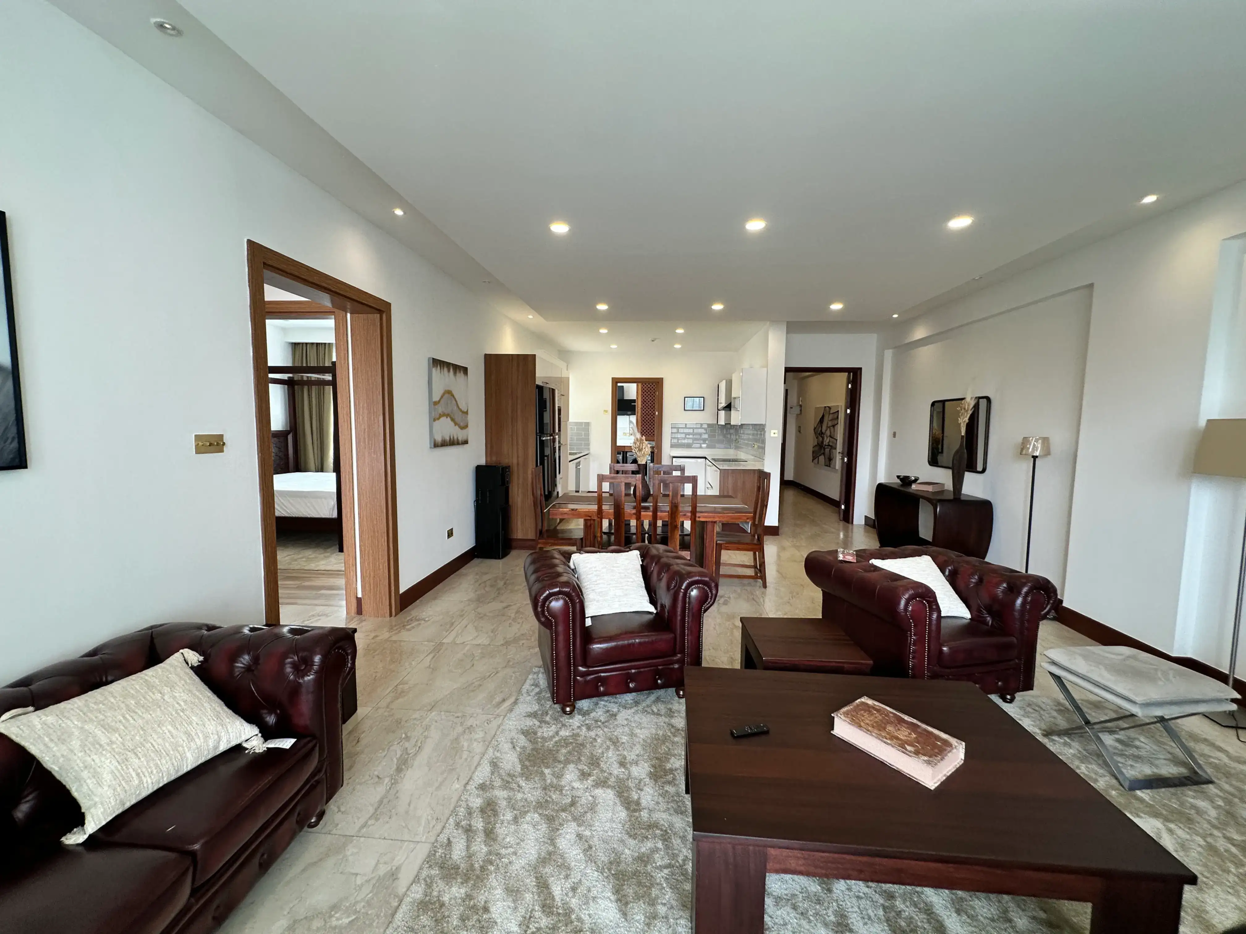 Furnished two-bedroom living and dining area at Colosseum Residences Parklands