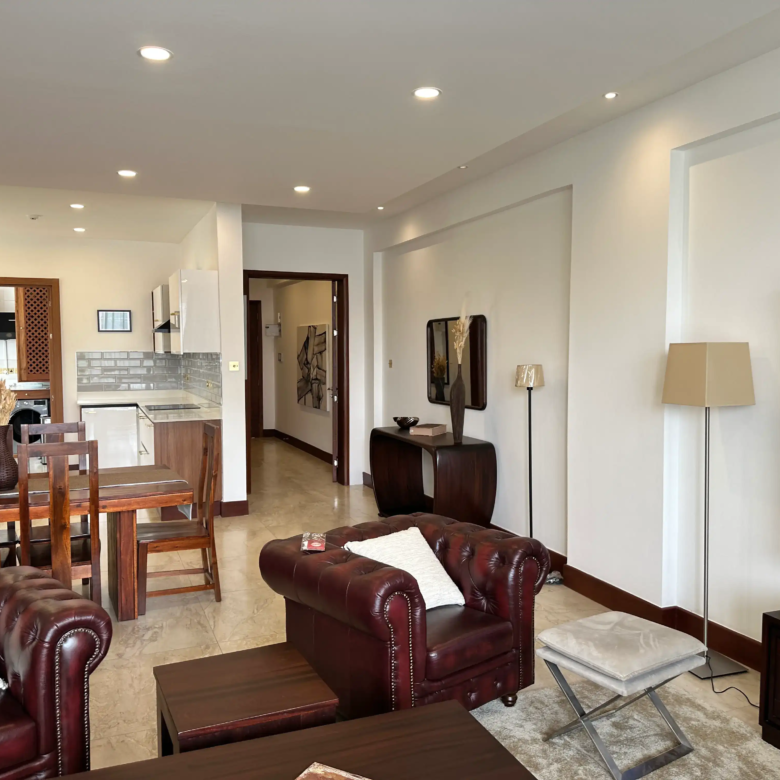 Leather lounge seating overlooking the dining area and kitchen
