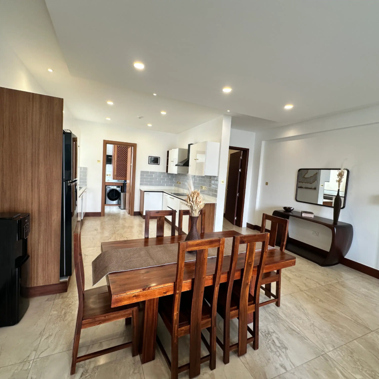Furnished dining room opening into a contemporary kitchen