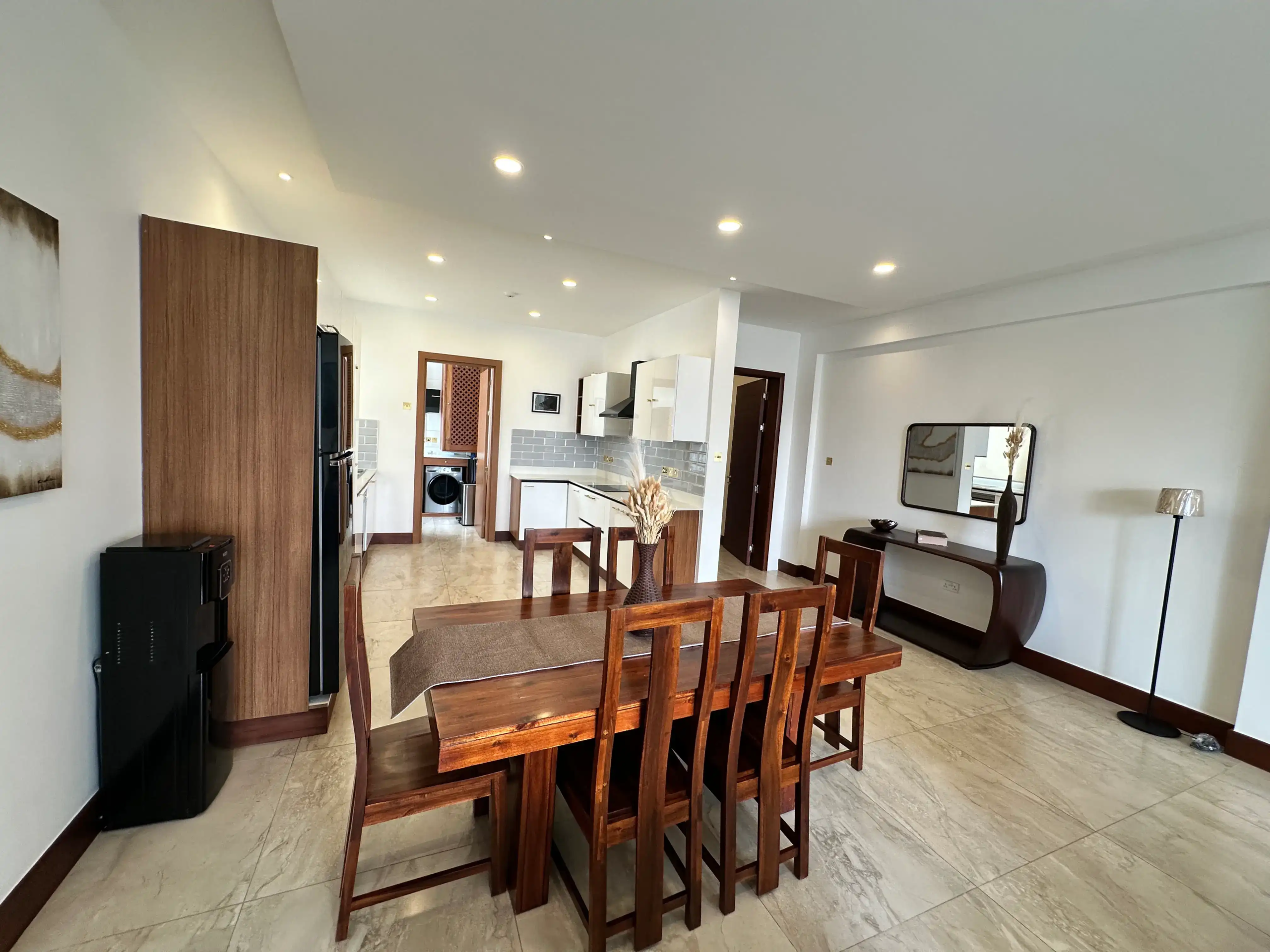Furnished dining room opening into a contemporary kitchen