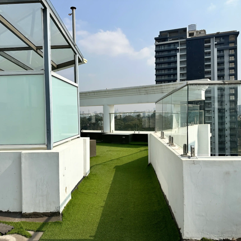 Rooftop walking track with glass railings and Nairobi views