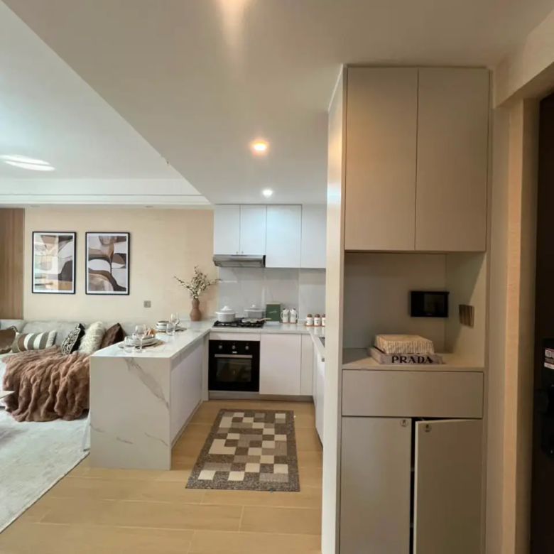 Fitted kitchen and entrance storage at Marble West Apartments