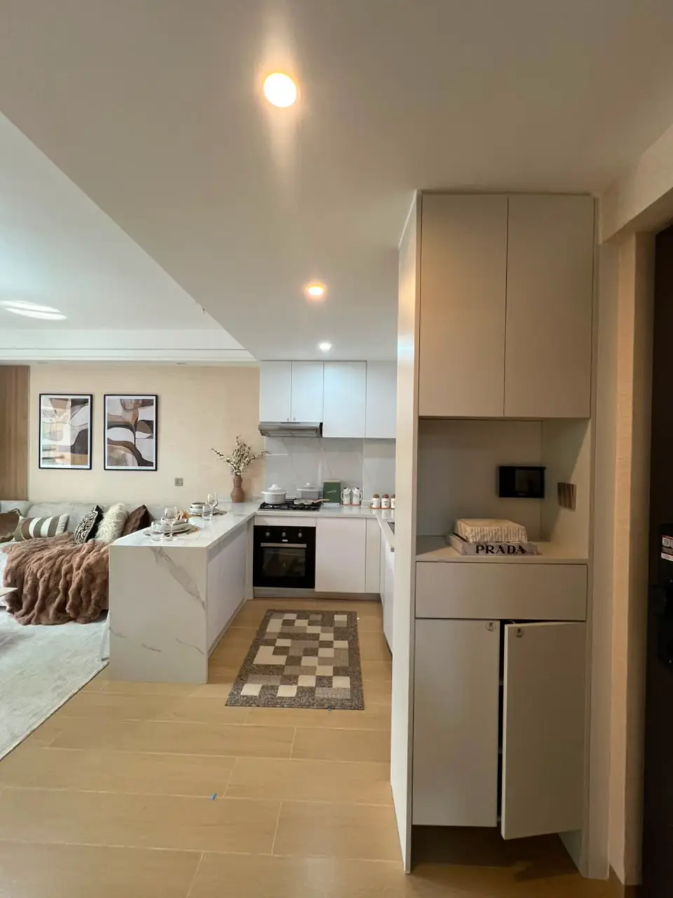 Fitted kitchen and entrance storage at Marble West Apartments