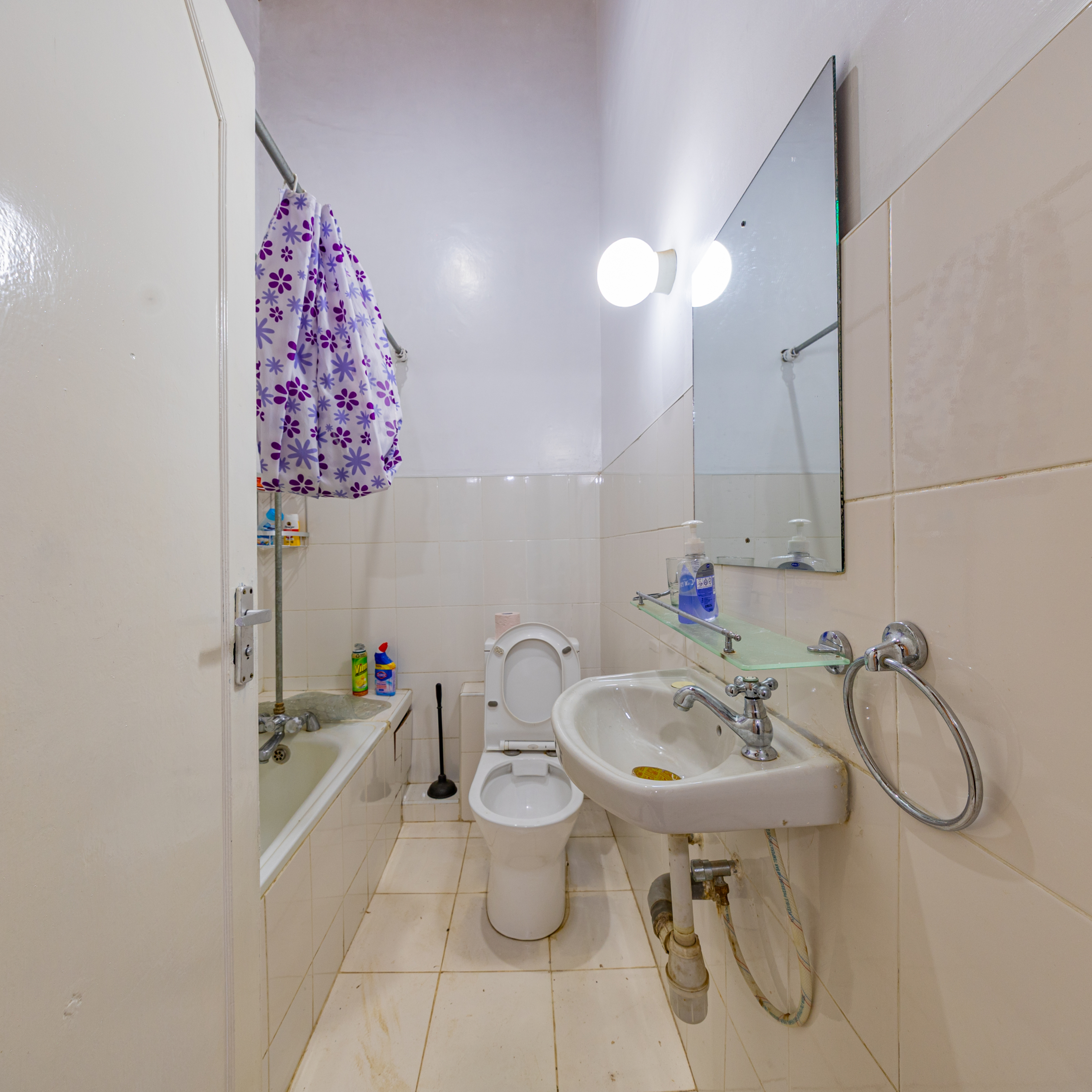 Bathroom with bathtub and sink in Oloitoktok Court townhouse Kileleshwa