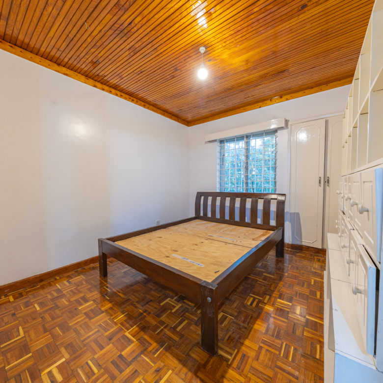 Bedroom with double bed and built-in wardrobes at Oloitoktok Court Kileleshwa