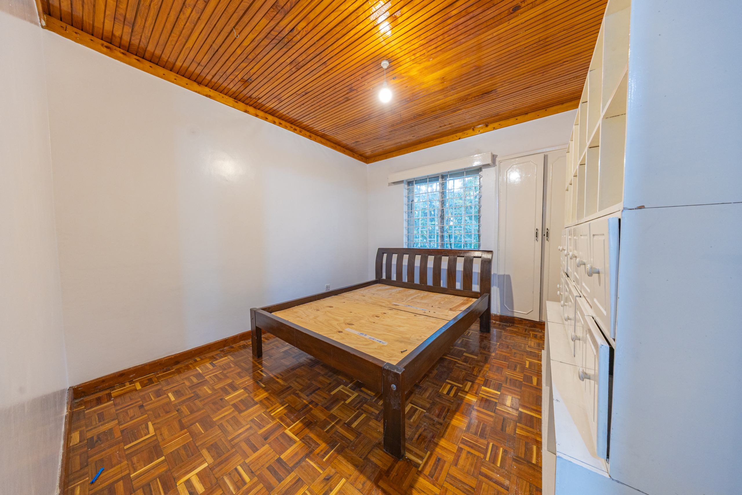 Bedroom with double bed and built-in wardrobes at Oloitoktok Court Kileleshwa