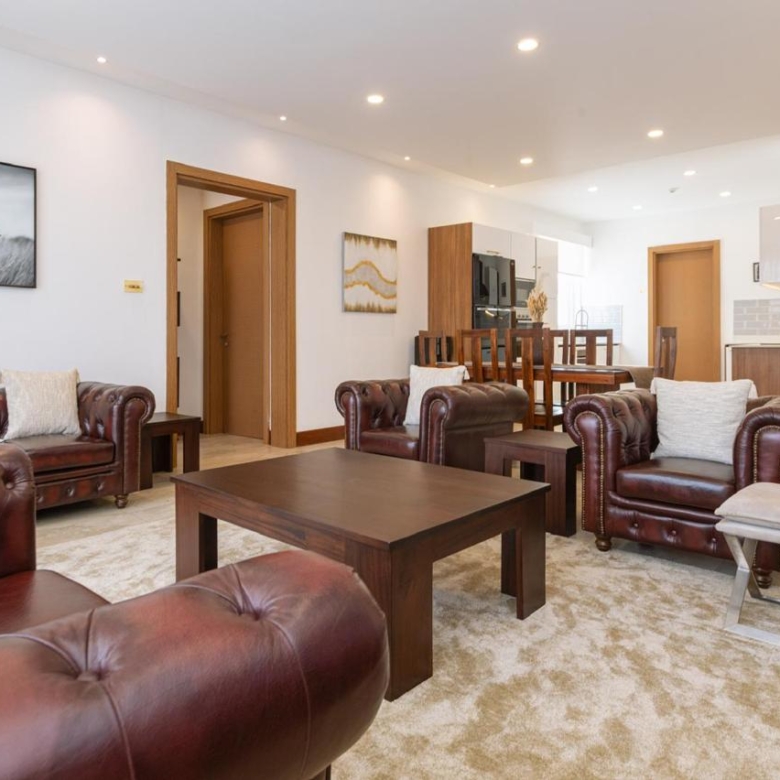 Spacious furnished living room and dining area in a serviced 2 bedroom Parklands apartment