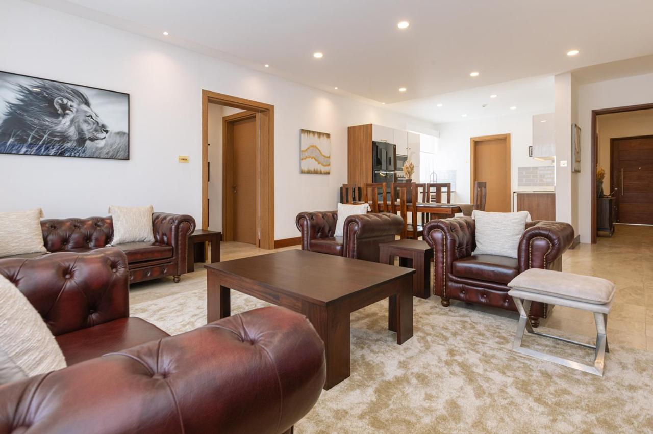 Spacious furnished living room and dining area in a serviced 2 bedroom Parklands apartment