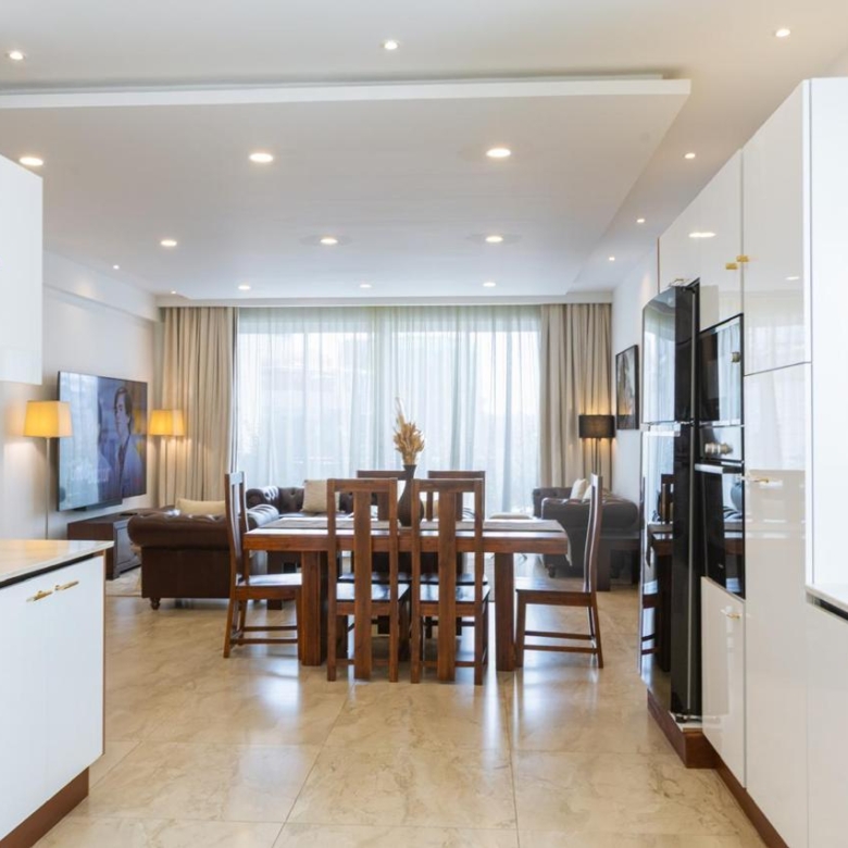 Open-plan kitchen and dining area in a serviced 2 bedroom apartment in Parklands