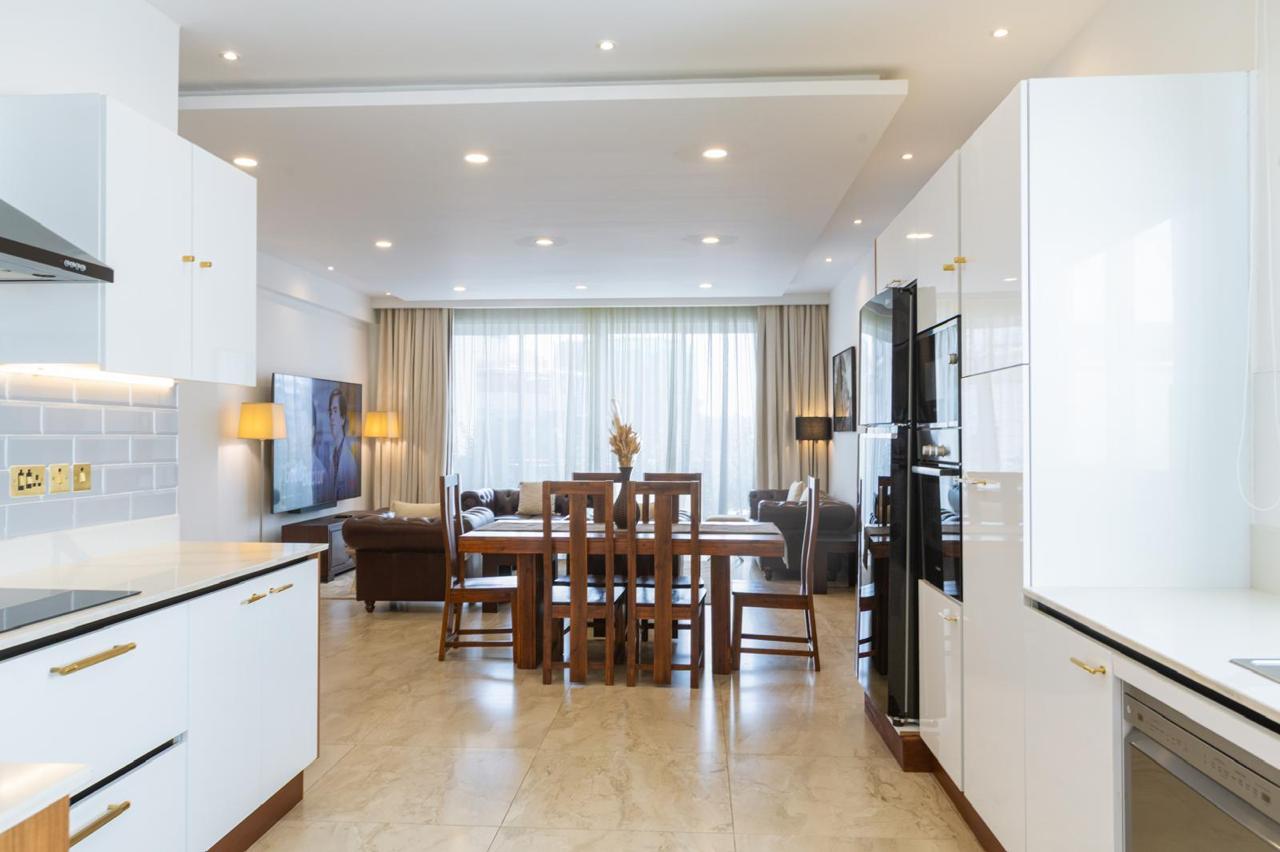 Open-plan kitchen and dining area in a serviced 2 bedroom apartment in Parklands