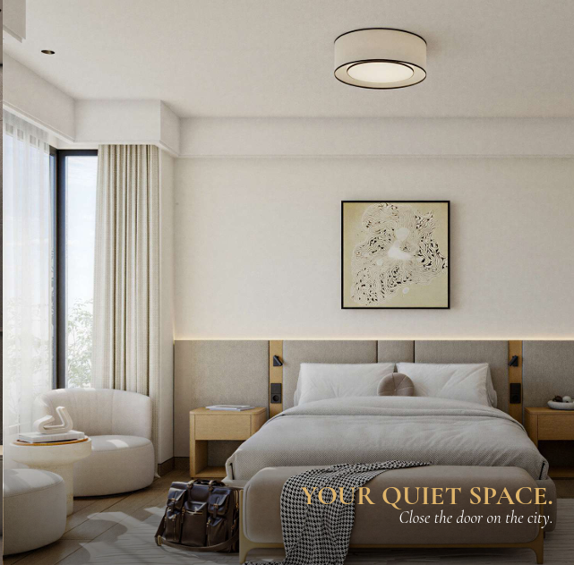 AERA Westlands bedroom with a modern upholstered bed, floor-to-ceiling windows, elegant curtains and a comfortable lounge chair.