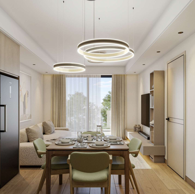 AERA Westlands apartment dining area featuring a modern dining table, upholstered chairs, contemporary lighting and a bright living space.