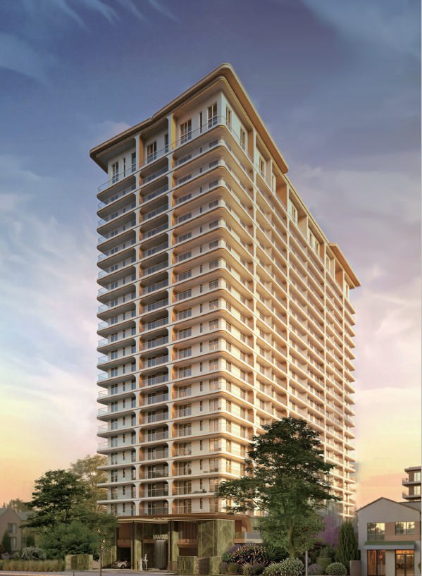 Avana Oasis Apartments illuminated residential tower at night with modern glass balconies and luxury entrance lighting.